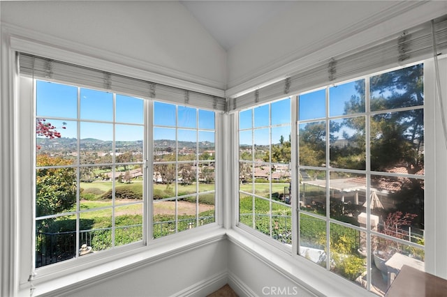 unfurnished sunroom featuring vaulted ceiling