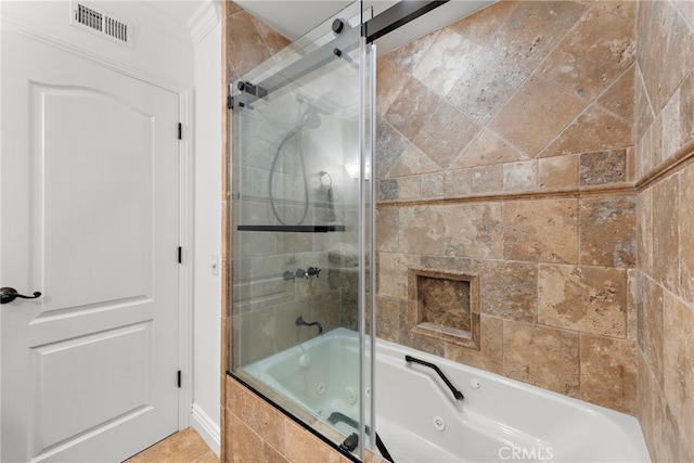 full bath with a combined bath / shower with jetted tub and visible vents