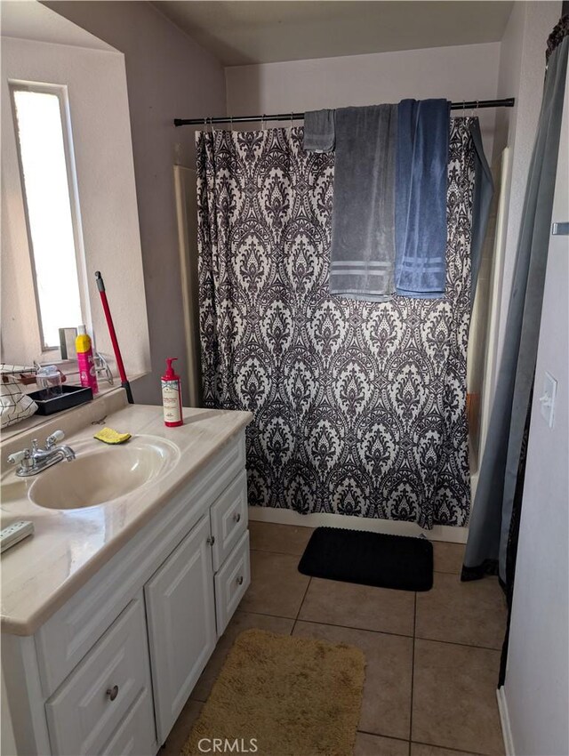 624 Kesha Ct, San Jacinto, CA 92583 - bathroom with vanity, tile patterned floors, and a shower with shower curtain