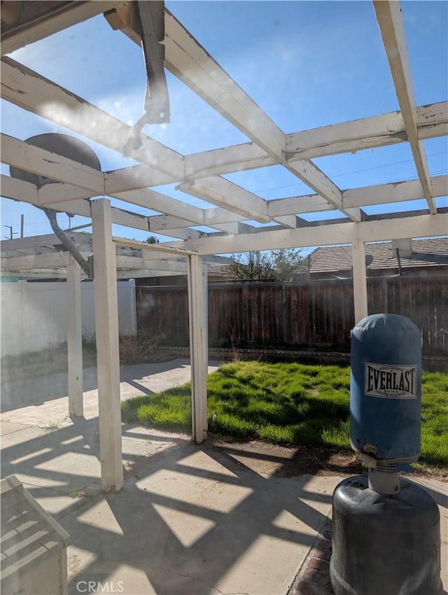 view of patio / terrace featuring a pergola and fence