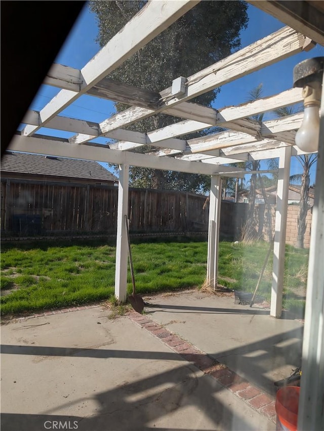 view of patio / terrace with a fenced backyard and a pergola