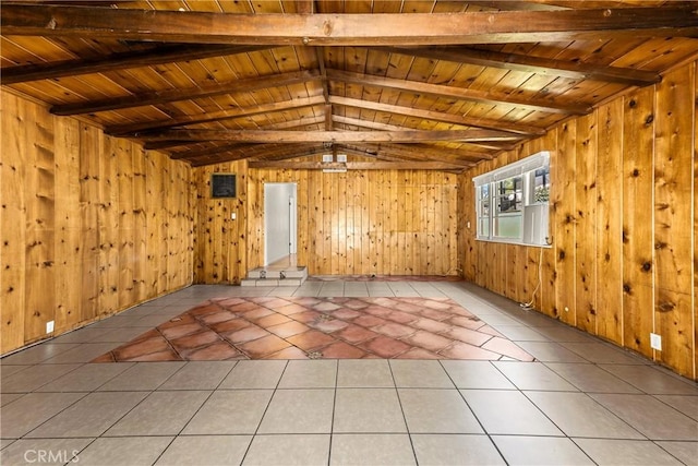 interior space featuring wooden walls, light tile patterned flooring, lofted ceiling with beams, and wood ceiling