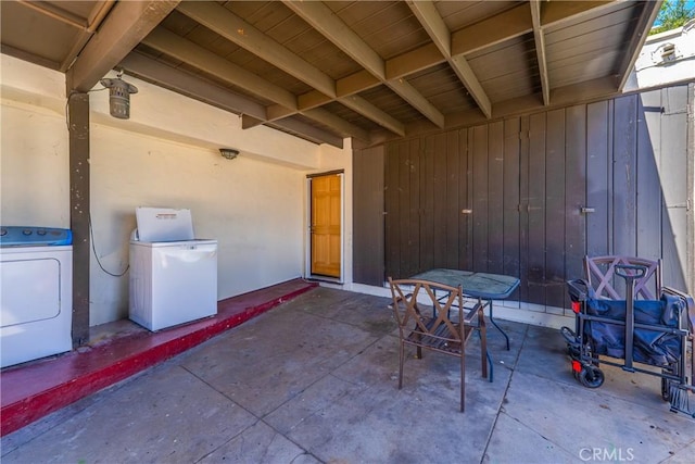 view of patio with separate washer and dryer
