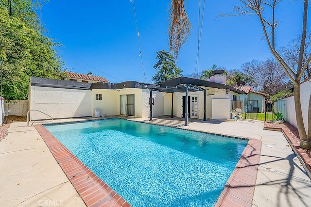 view of swimming pool with a fenced in pool, a patio, and a fenced backyard