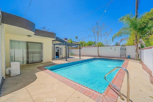 view of swimming pool featuring a patio area, a fenced backyard, and a fenced in pool
