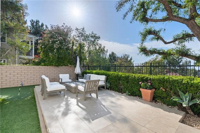 view of patio with a fenced backyard and outdoor lounge area