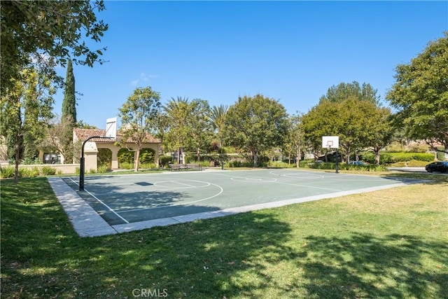 view of sport court featuring community basketball court and a lawn