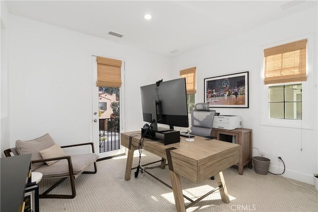 office area with visible vents, baseboards, recessed lighting, and light carpet