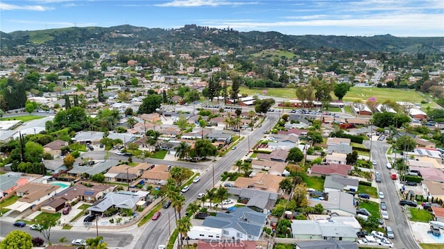 drone / aerial view featuring a residential view and a mountain view