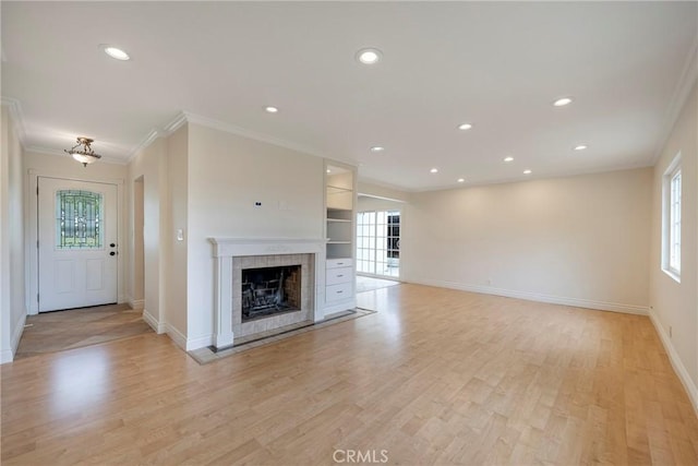 18342 Avolinda Dr, Yorba Linda, CA 92886 - unfurnished living room featuring baseboards, ornamental molding, a tile fireplace, recessed lighting, and light wood-style flooring