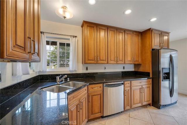 18342 Avolinda Dr, Yorba Linda, CA 92886 - kitchen with stainless steel appliances, a sink, brown cabinetry, dark stone countertops, and recessed lighting