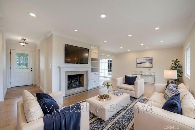 18342 Avolinda Dr, Yorba Linda, CA 92886 - living area with recessed lighting, a tile fireplace, ornamental molding, light wood finished floors, and baseboards