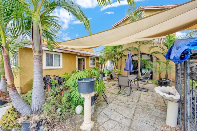 view of patio / terrace featuring fence and outdoor dining space