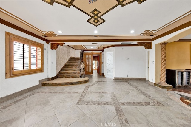 entryway with stairs, ornate columns, baseboards, ornamental molding, and recessed lighting