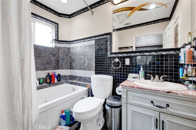 full bath with tile walls, toilet, vanity, and a bathtub