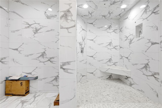 full bathroom with a marble finish shower