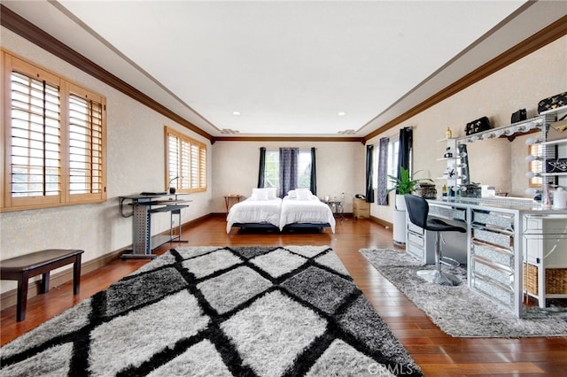 bedroom with wood finished floors, crown molding, and baseboards