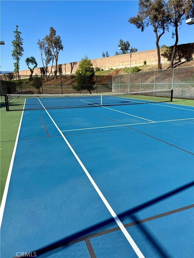 view of sport court with community basketball court and fence
