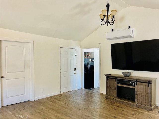 4225 Poplar Trl, Frazier Park, CA 93225 - unfurnished living room featuring lofted ceiling, a chandelier, wood finished floors, and an AC wall unit