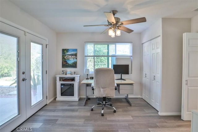 office area featuring visible vents, french doors, baseboards, and light wood-style floors