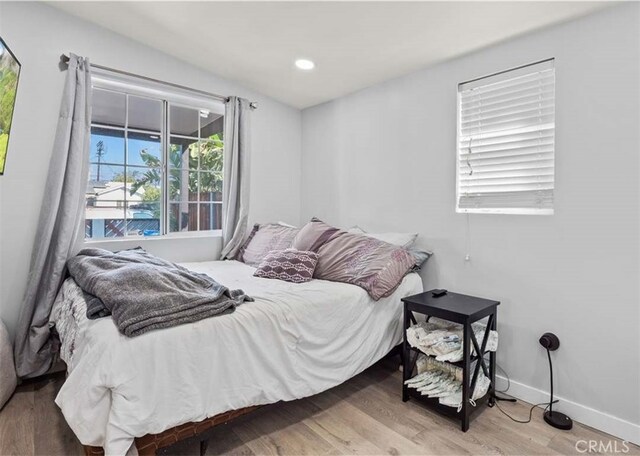 13118 Hoyt St, Pacoima, CA 91331 - bedroom featuring recessed lighting, baseboards, and wood finished floors