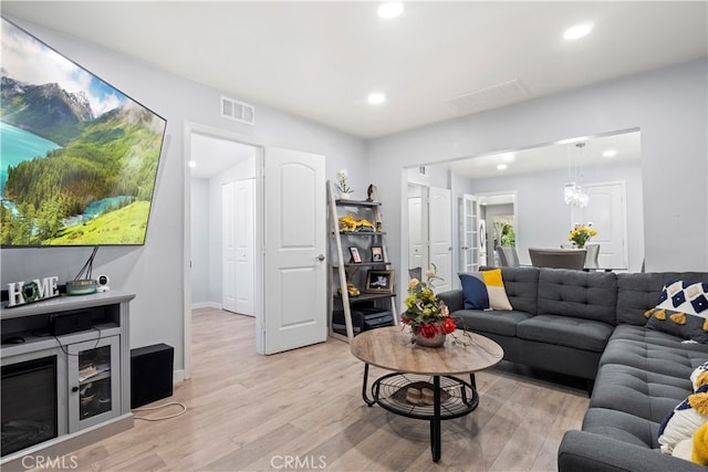 13118 Hoyt St, Pacoima, CA 91331 - living room featuring recessed lighting, visible vents, and light wood-style floors