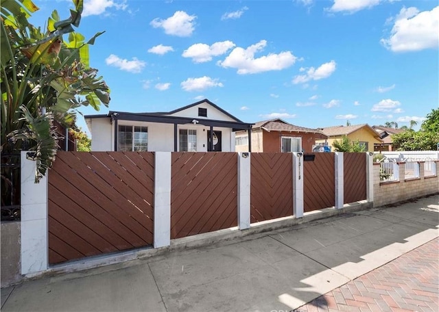 13118 Hoyt St, Pacoima, CA 91331 - ranch-style house with a fenced front yard, a gate, and stucco siding