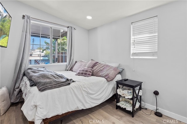 13118 Hoyt St, Pacoima, CA 91331 - bedroom with baseboards, wood finished floors, and recessed lighting