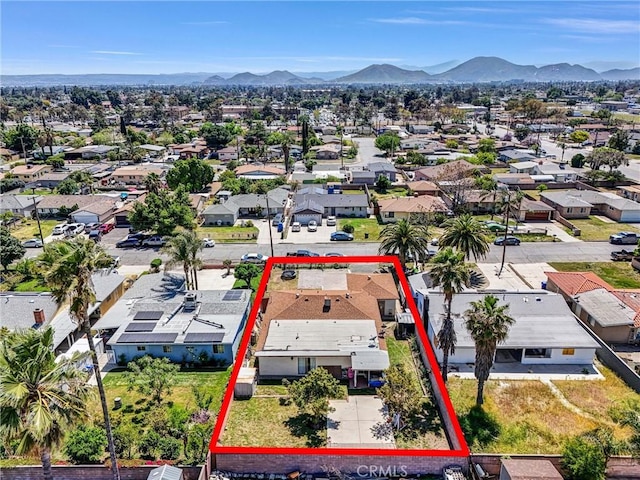aerial view featuring a mountain view and a residential view