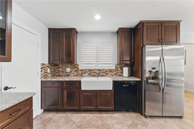kitchen with dishwasher, stainless steel fridge, a sink, and decorative backsplash