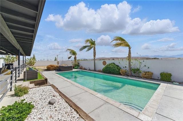 view of pool with a patio, a fenced in pool, and a fenced backyard