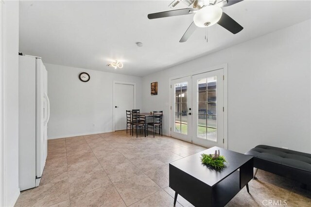 living room with light tile patterned floors, french doors, and a ceiling fan