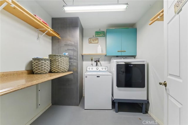laundry area with cabinet space and washer and dryer