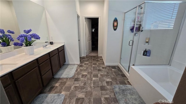 34306 Kensington St, Murrieta, CA 92563 - bathroom with a bath, stone finish flooring, a stall shower, double vanity, and baseboards