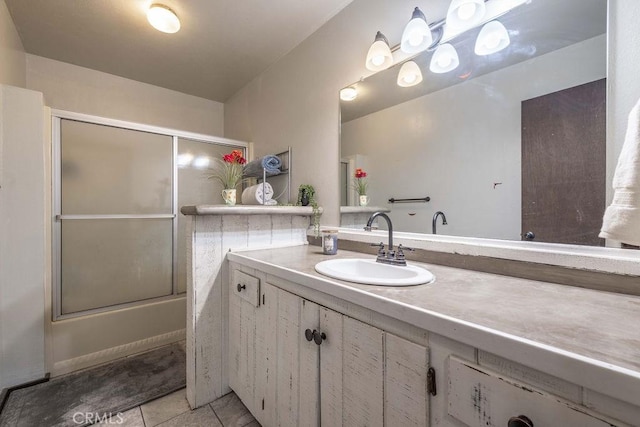 1066 Paradise Way, Big Bear City, CA 92314 - full bathroom with tile patterned flooring, vanity, and bath / shower combo with glass door