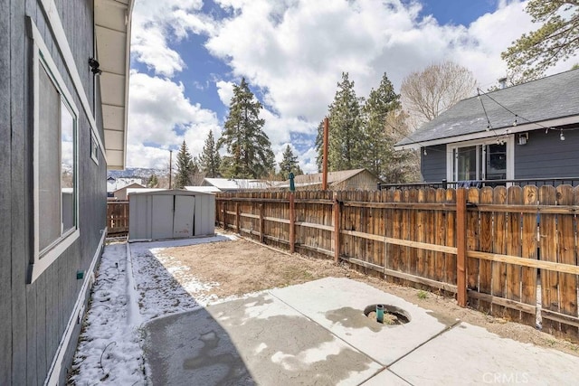 1066 Paradise Way, Big Bear City, CA 92314 - view of patio / terrace with an outbuilding, a storage shed, and fence private yard