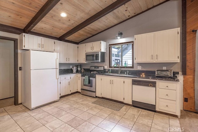 1066 Paradise Way, Big Bear City, CA 92314 - kitchen featuring vaulted ceiling with beams, dark countertops, a sink, and stainless steel appliances