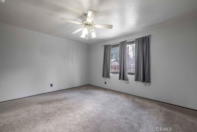 1066 Paradise Way, Big Bear City, CA 92314 - empty room with carpet, a textured ceiling, and ceiling fan