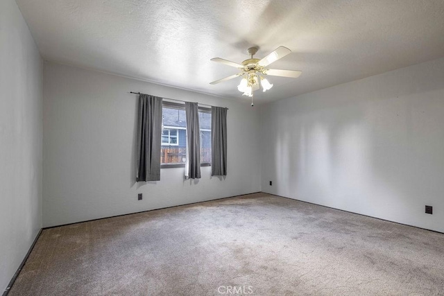 1066 Paradise Way, Big Bear City, CA 92314 - carpeted empty room featuring a ceiling fan and a textured ceiling