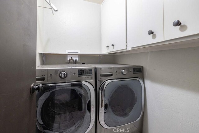 1066 Paradise Way, Big Bear City, CA 92314 - clothes washing area with washer and dryer and cabinet space