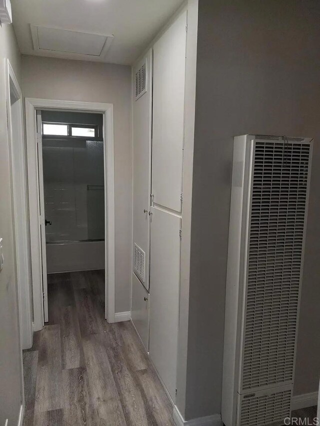 11311135 Emory St, Imperial Beach, CA 91932 - corridor featuring a heating unit, light wood-type flooring, baseboards, and attic access