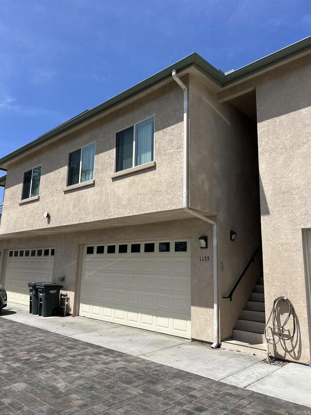 11311135 Emory St, Imperial Beach, CA 91932 - view of home's exterior with stucco siding and an attached garage