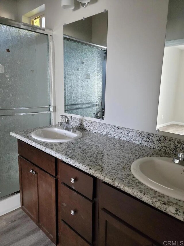11311135 Emory St, Imperial Beach, CA 91932 - bathroom with double vanity, a stall shower, and wood finished floors