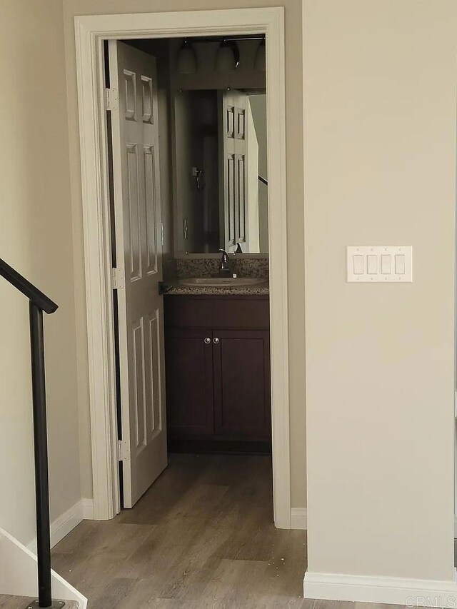 11311135 Emory St, Imperial Beach, CA 91932 - hallway featuring baseboards, a sink, and light wood-style flooring