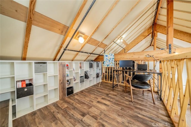 interior space with wood finished floors and vaulted ceiling with beams