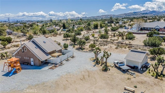 drone / aerial view with a mountain view and view of desert