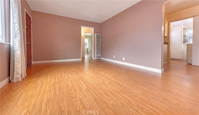 3611 4th Ave, La Crescenta, CA 91214 - empty room featuring light wood-style flooring, baseboards, and a heating unit