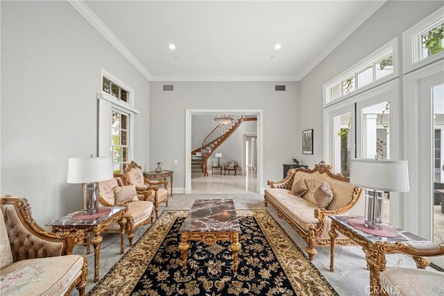 living area with crown molding, stairs, visible vents, and recessed lighting