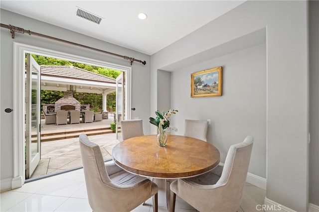 dining area featuring recessed lighting, baseboards, visible vents, and light tile patterned floors