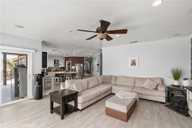 14445 Dove Canyon Dr, Riverside, CA 92503 - living room with ceiling fan, light wood-style flooring, recessed lighting, and ornamental molding